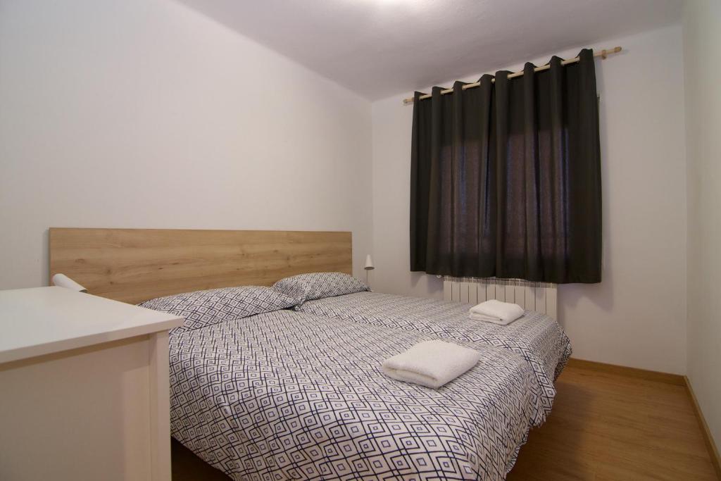 Postel nebo postele na pokoji v ubytování Apartaments IXA
