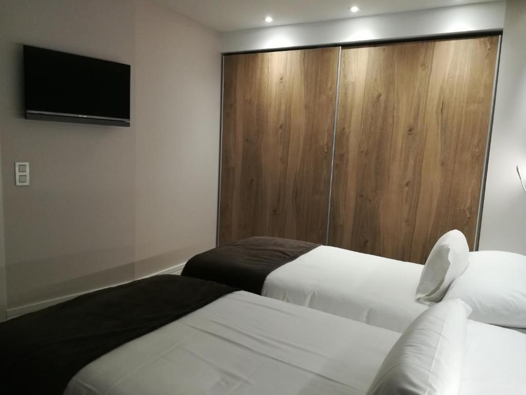 Postel nebo postele na pokoji v ubytování Hotel & Spa Ciudad de Binéfar