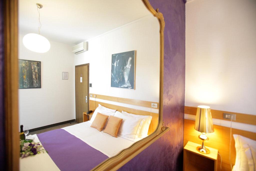 Postel nebo postele na pokoji v ubytování Art Hotel