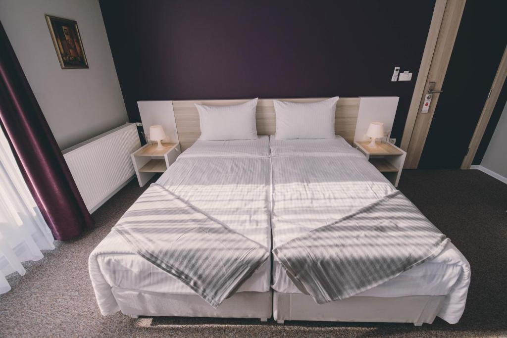 Posteľ alebo postele v izbe v ubytovaní Hotel Nova Bentbaša