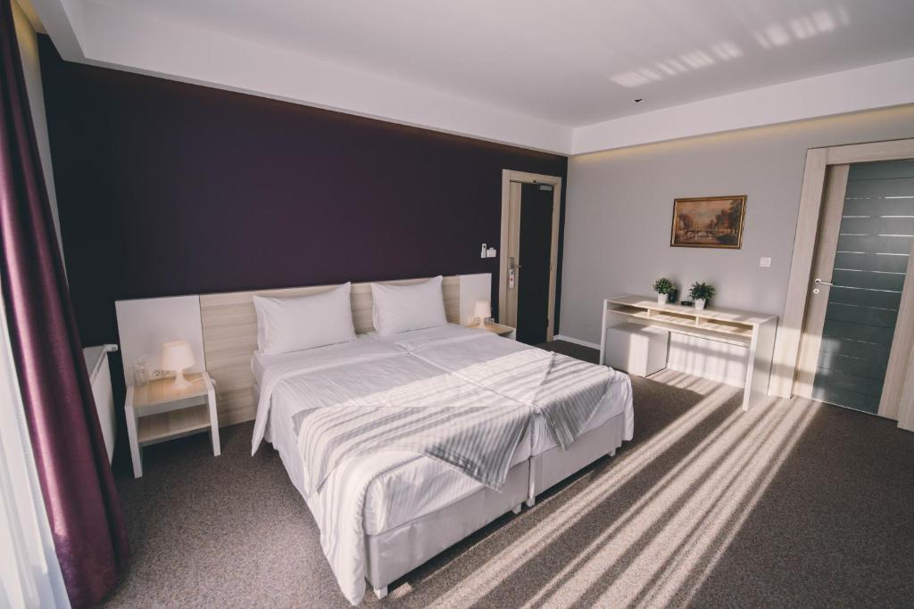 Posteľ alebo postele v izbe v ubytovaní Hotel Nova Bentbaša