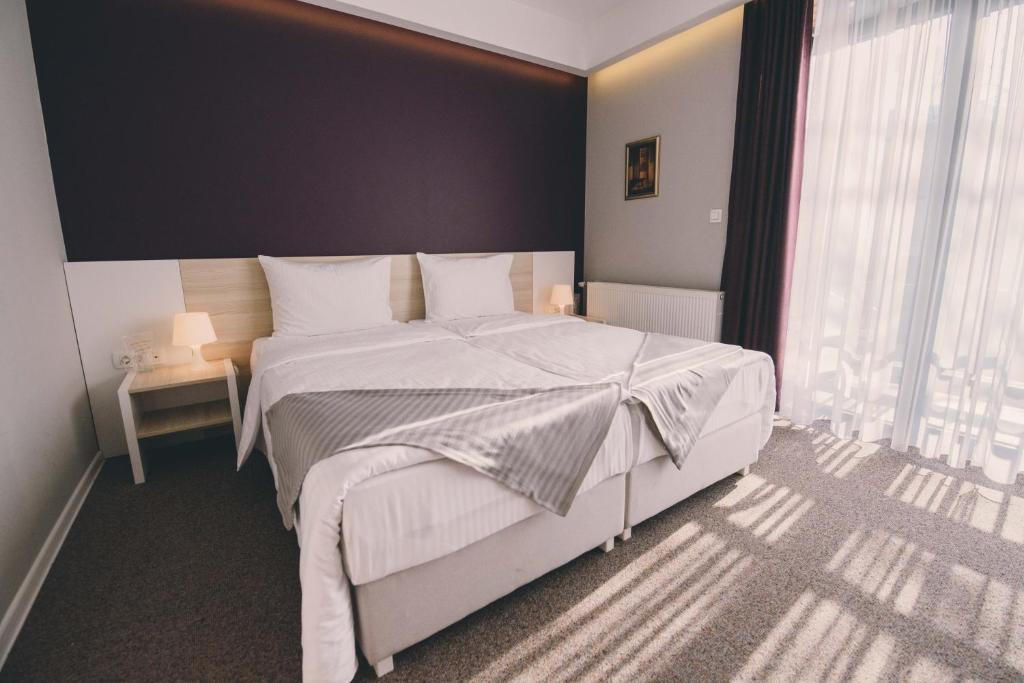 Posteľ alebo postele v izbe v ubytovaní Hotel Nova Bentbaša