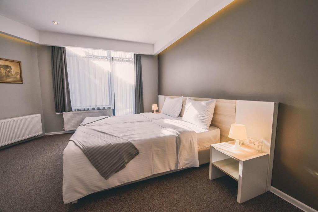 Posteľ alebo postele v izbe v ubytovaní Hotel Nova Bentbaša