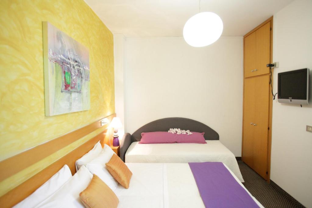 Postel nebo postele na pokoji v ubytování Art Hotel