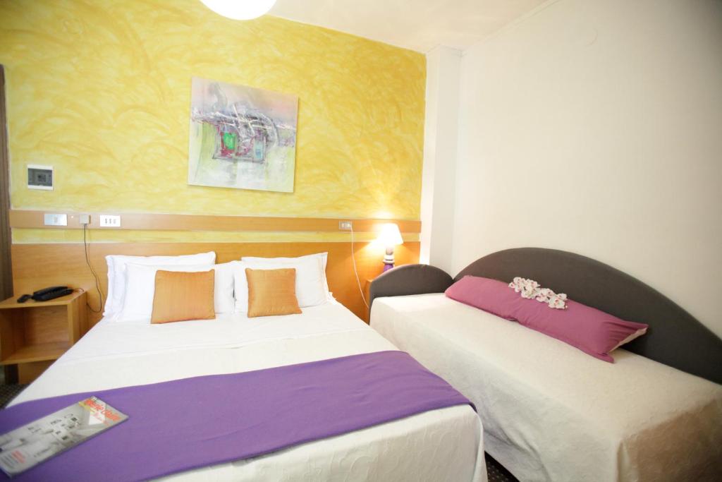 Postel nebo postele na pokoji v ubytování Art Hotel