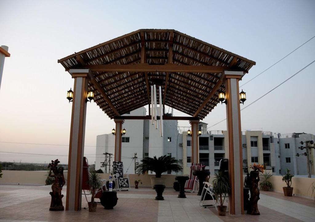 a large wooden at Hotel Surbhi in Mundra