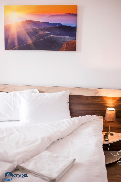 Postel nebo postele na pokoji v ubytování Citadel Aparthotel