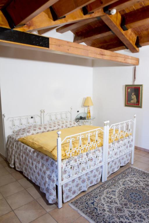 Postel nebo postele na pokoji v ubytování Villa Scalabrini