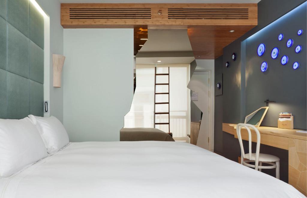 Postel nebo postele na pokoji v ubytování New Hotel