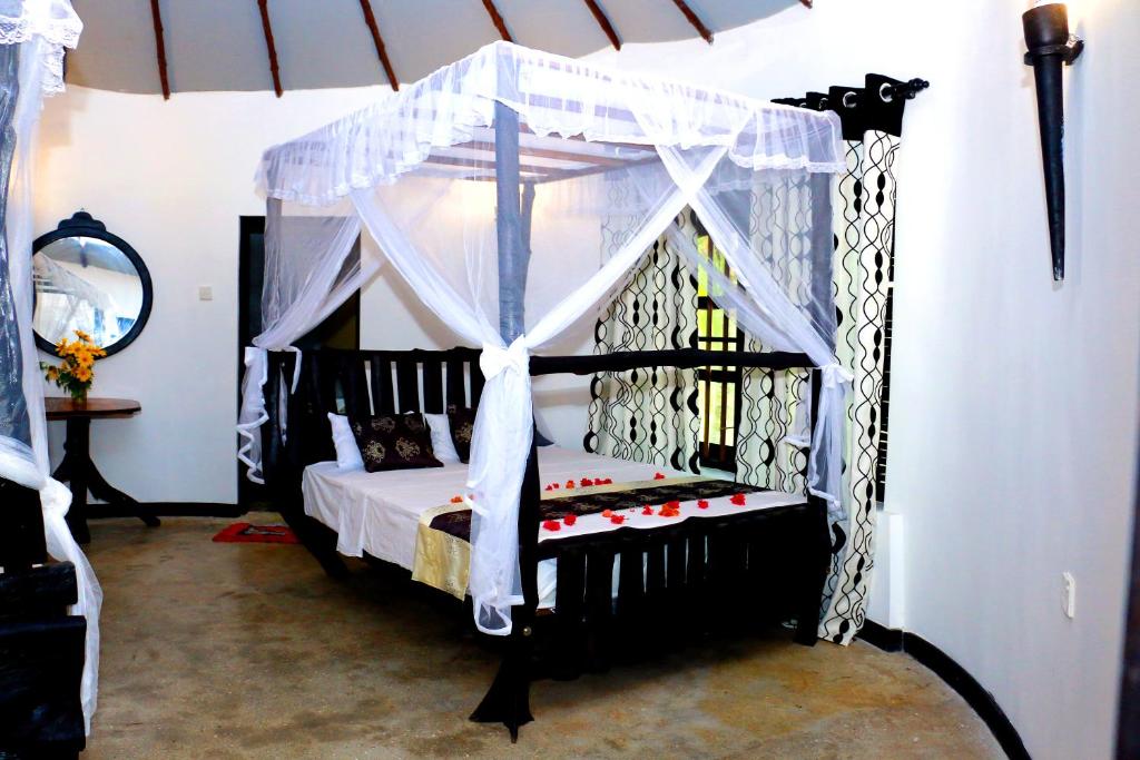 A bed or beds in a room at Turtle Watch Cabana