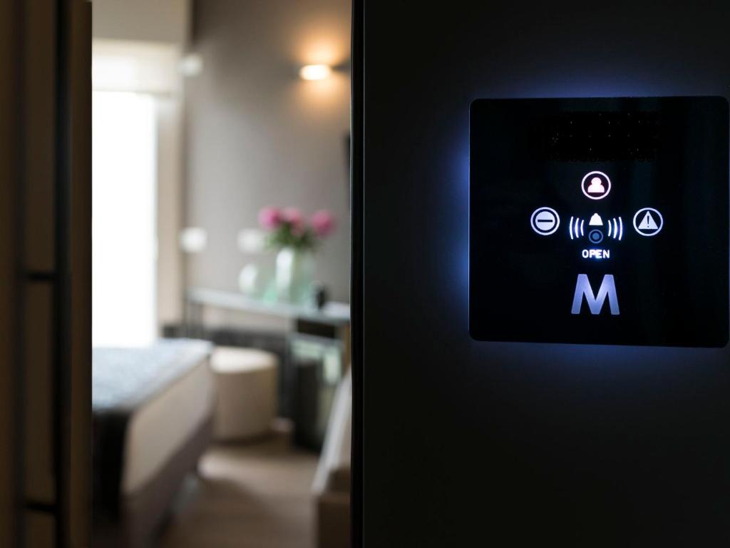 Postel nebo postele na pokoji v ubytování Hotel Michelangelo