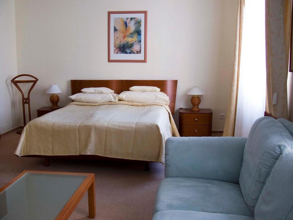 Postel nebo postele na pokoji v ubytování Klub Hotel