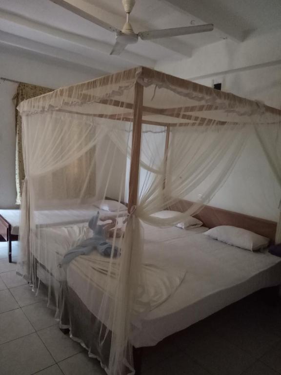 Postel nebo postele na pokoji v ubytování Hansa Surf Hotel