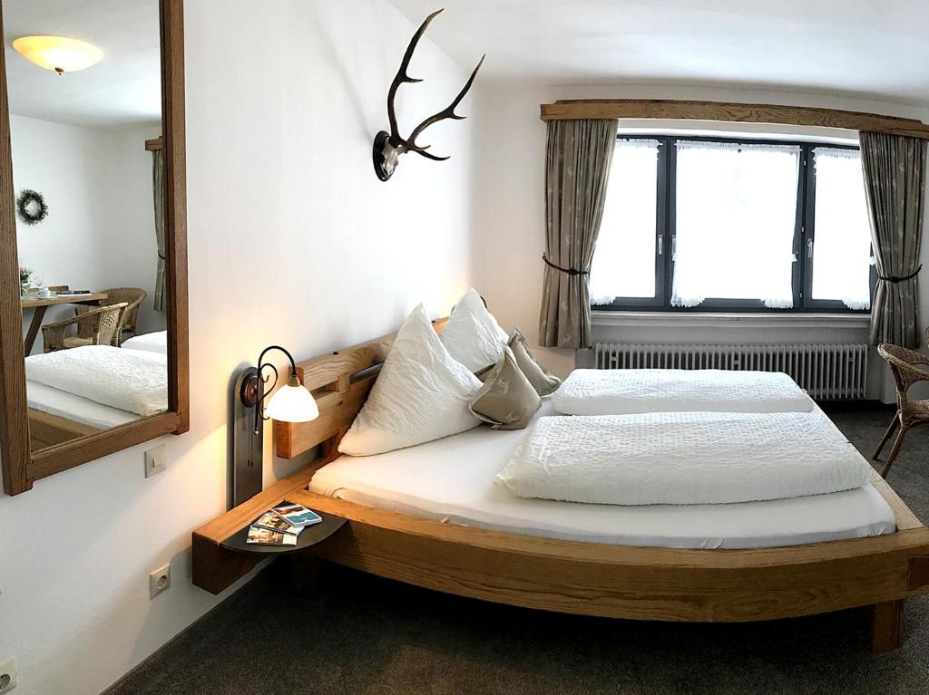Postel nebo postele na pokoji v ubytování Gästehaus Pointner
