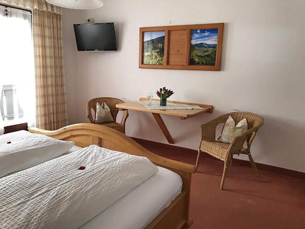 Postel nebo postele na pokoji v ubytování Gästehaus Pointner