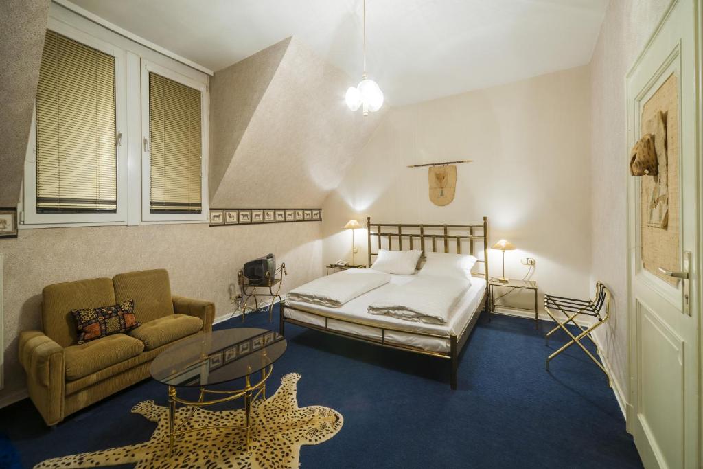 Postel nebo postele na pokoji v ubytování Hotel am Berg