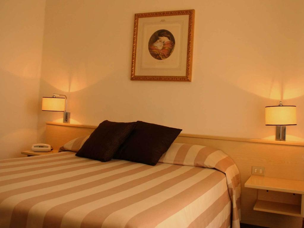 Postel nebo postele na pokoji v ubytování Hotel Ancora Riviera