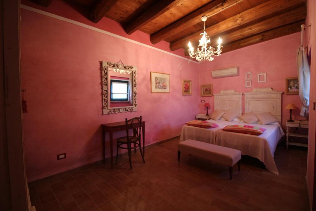 Postel nebo postele na pokoji v ubytování Poggio Montali