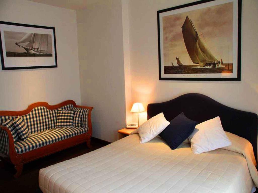Postel nebo postele na pokoji v ubytování Hotel Ancora Riviera