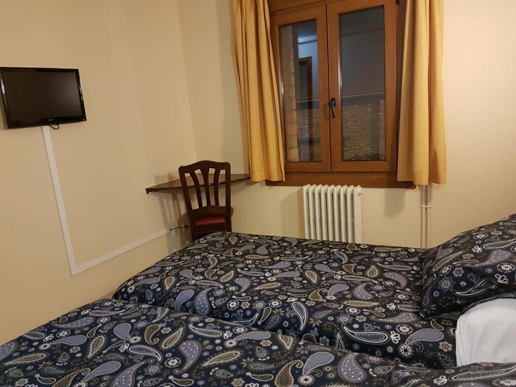 Postel nebo postele na pokoji v ubytování Hotel Arinsal