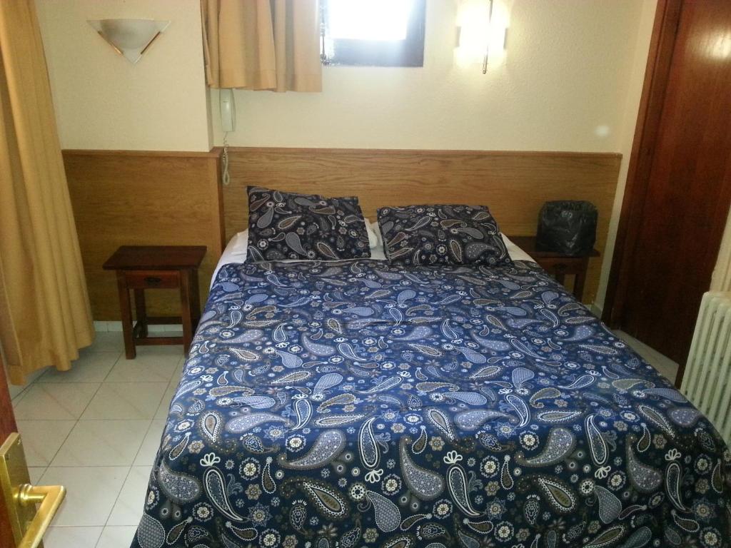 Postel nebo postele na pokoji v ubytování Hotel Arinsal