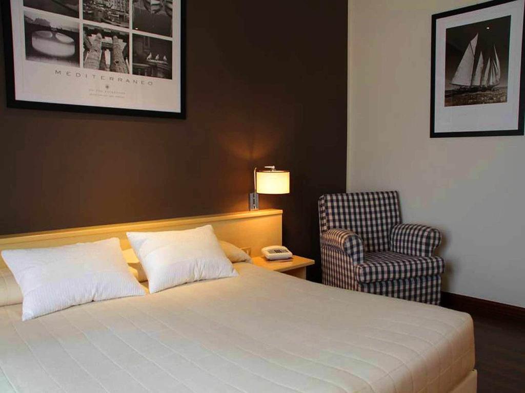 Postel nebo postele na pokoji v ubytování Hotel Ancora Riviera
