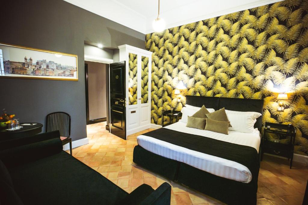 a bedroom with a large bed with a yellow wall at Hotel Parrasio in Rome