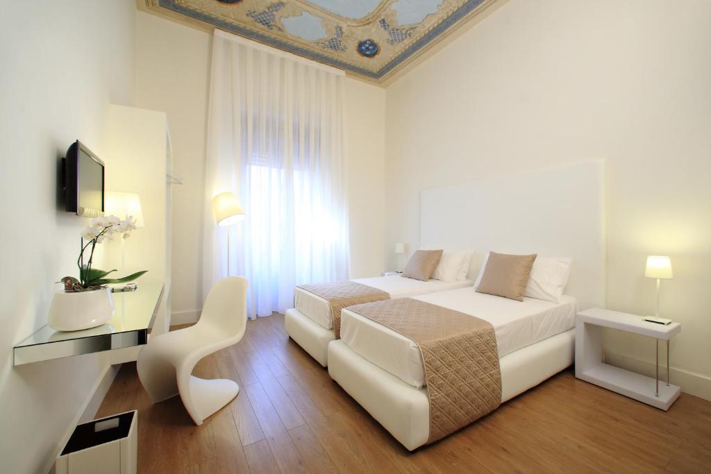 Postel nebo postele na pokoji v ubytování Al Castello Luxury B&B