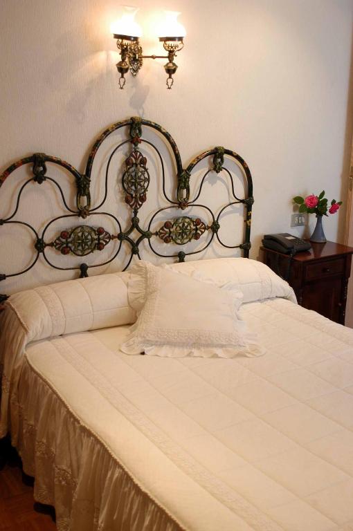 Postel nebo postele na pokoji v ubytování Hotel Julia