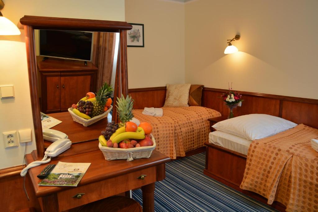 Postel nebo postele na pokoji v ubytování Spa & Wellness Hotel Harmonie