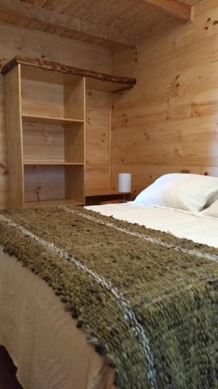 Postel nebo postele na pokoji v ubytování HelChiloé Cabañas