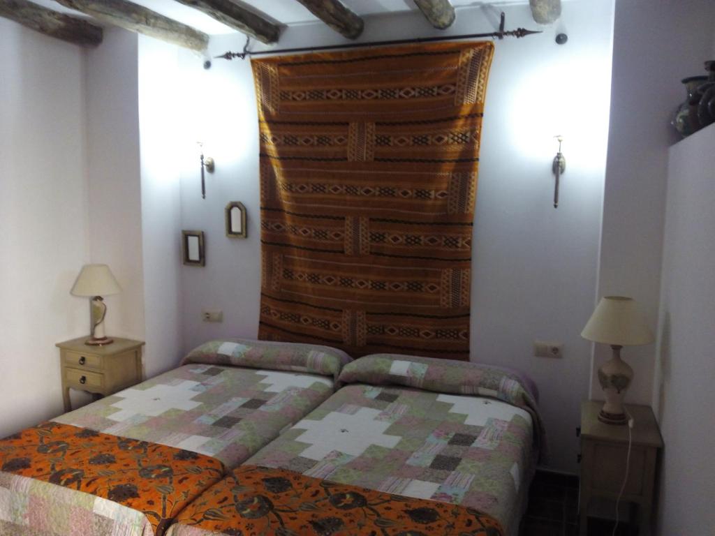 Postel nebo postele na pokoji v ubytování El Sueño de Lucrecia