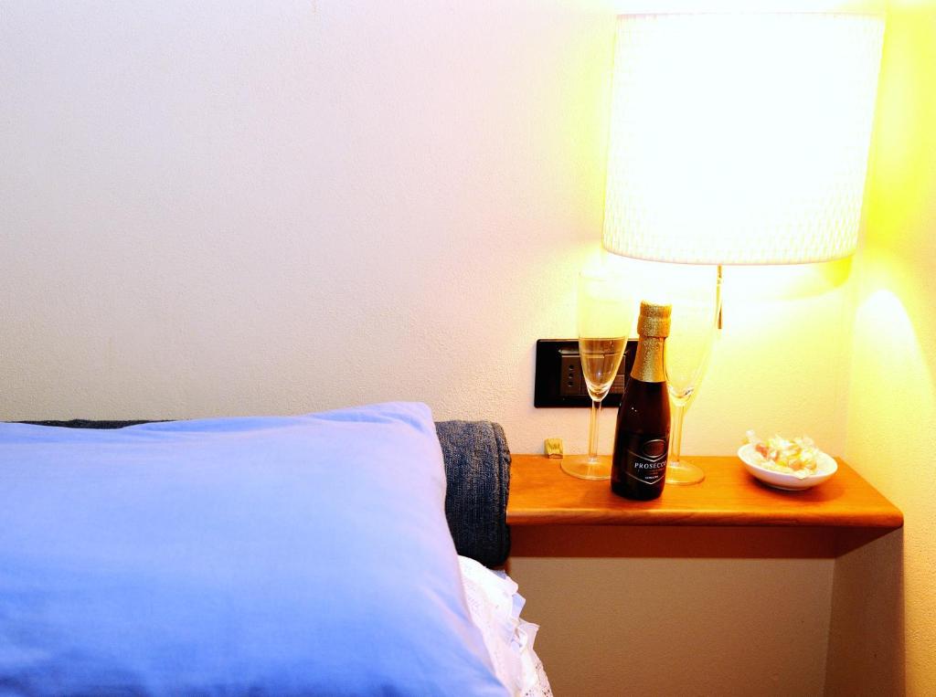 Postel nebo postele na pokoji v ubytování B&B Le Casette Di Lù