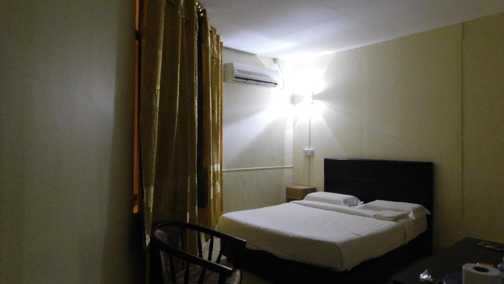 Postel nebo postele na pokoji v ubytování Hotel Ocean