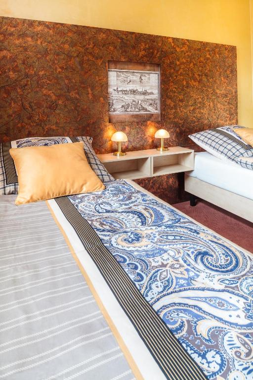 Uma cama ou camas num quarto em Hotel Conti