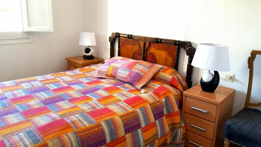 Postelja oz. postelje v sobi nastanitve Casa con jardín a 5' de Aranda de Duero