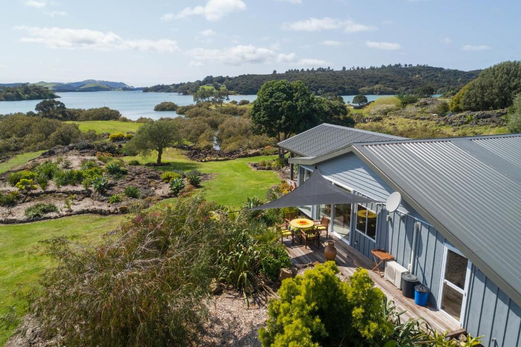 an aerial view of a house with a view of the water at Valhalla North & Northern Lodge - waterfront, rural, semi-isolated in Kerikeri