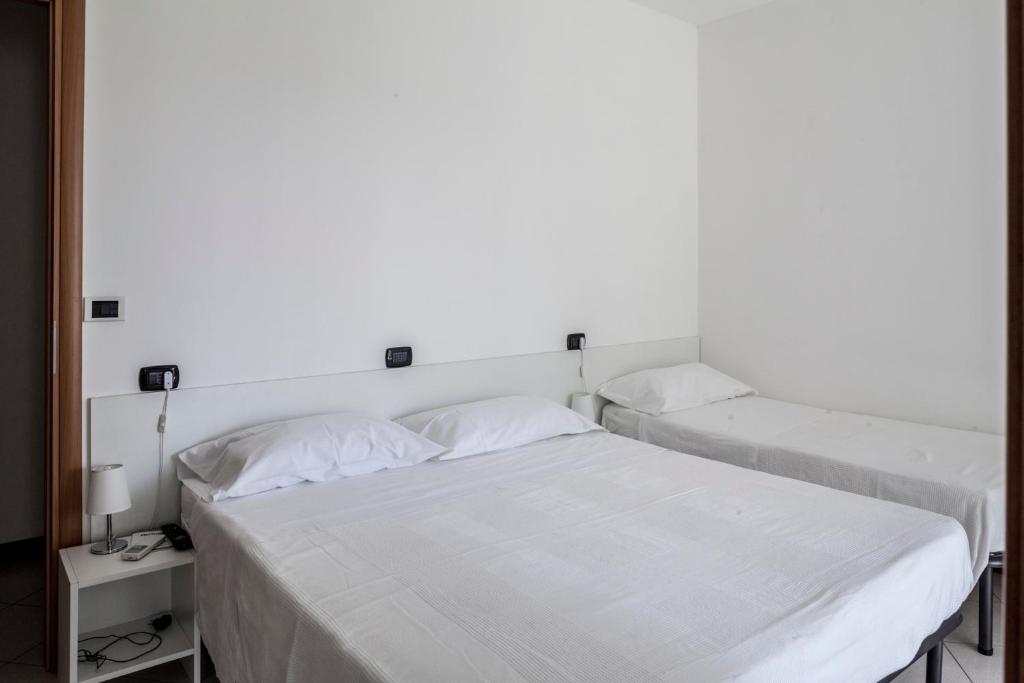 A bed or beds in a room at Bed & Breakfast Cesarina