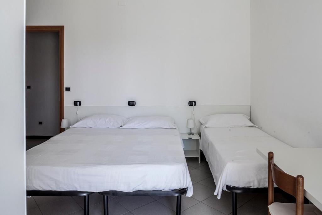 A bed or beds in a room at Bed & Breakfast Cesarina