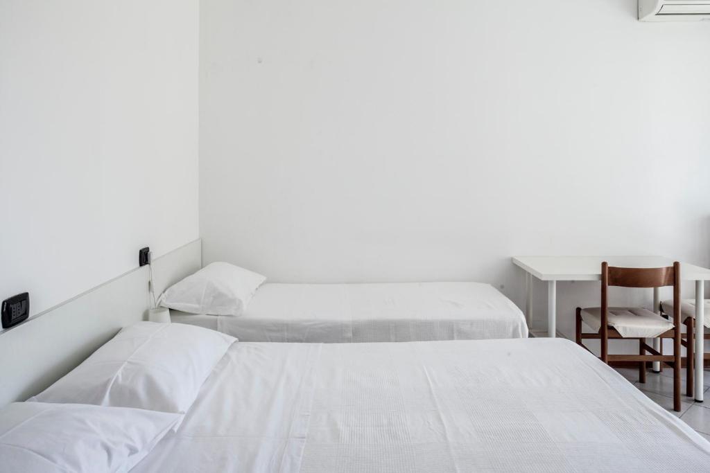 A bed or beds in a room at Bed & Breakfast Cesarina