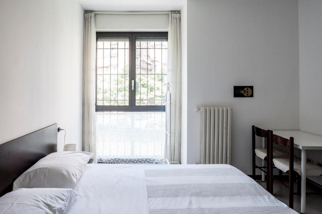 A bed or beds in a room at Bed & Breakfast Cesarina