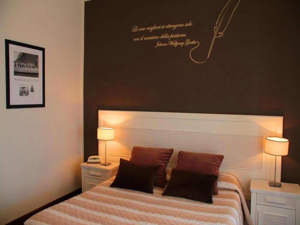 Postel nebo postele na pokoji v ubytování Hotel Ancora Riviera
