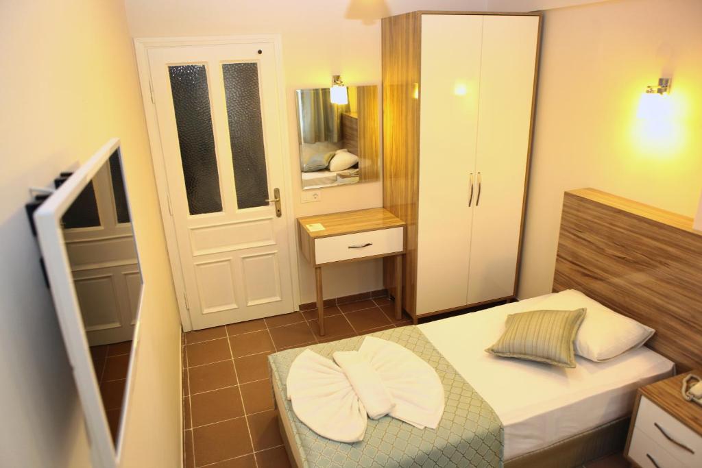 Postel nebo postele na pokoji v ubytování Narcis Apart Hotel