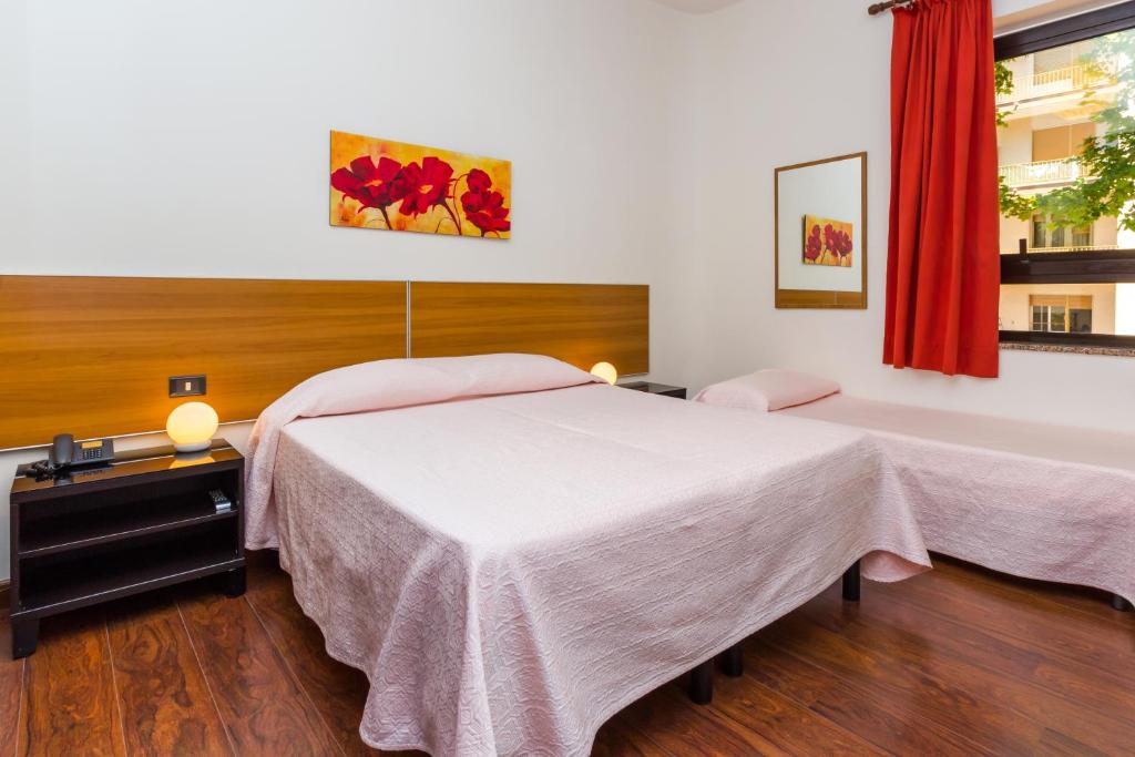 Postel nebo postele na pokoji v ubytování Hotel Adria