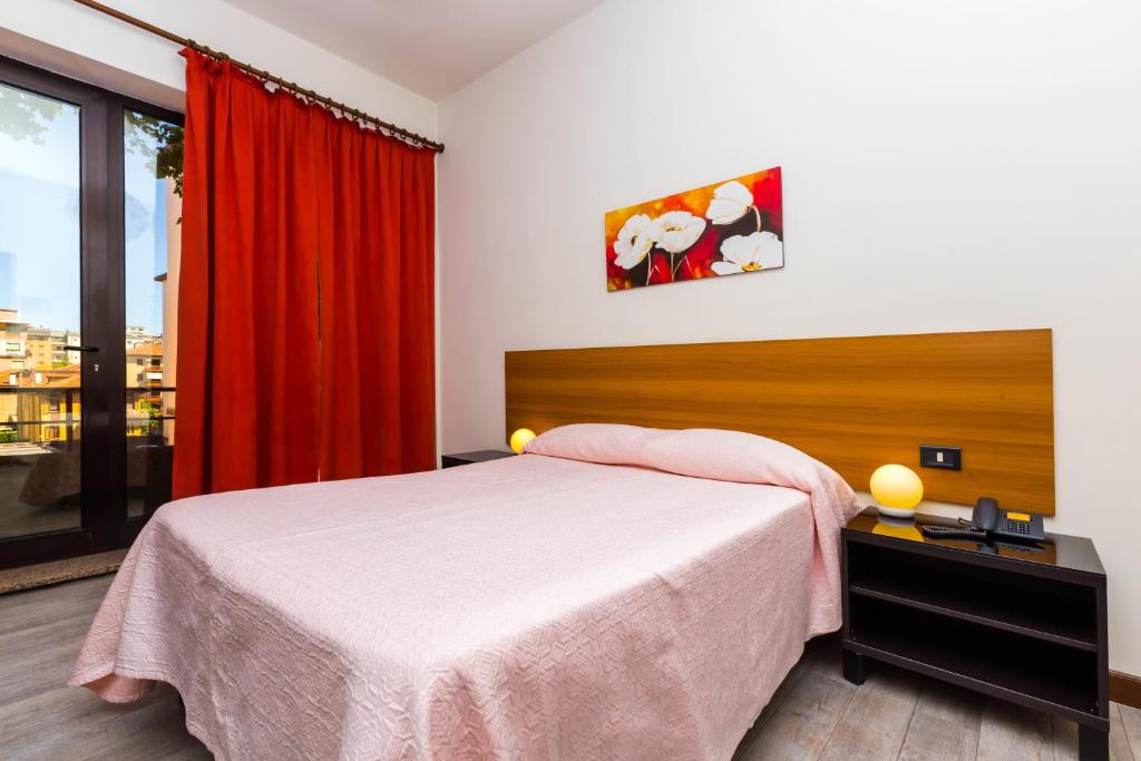 Postel nebo postele na pokoji v ubytování Hotel Adria