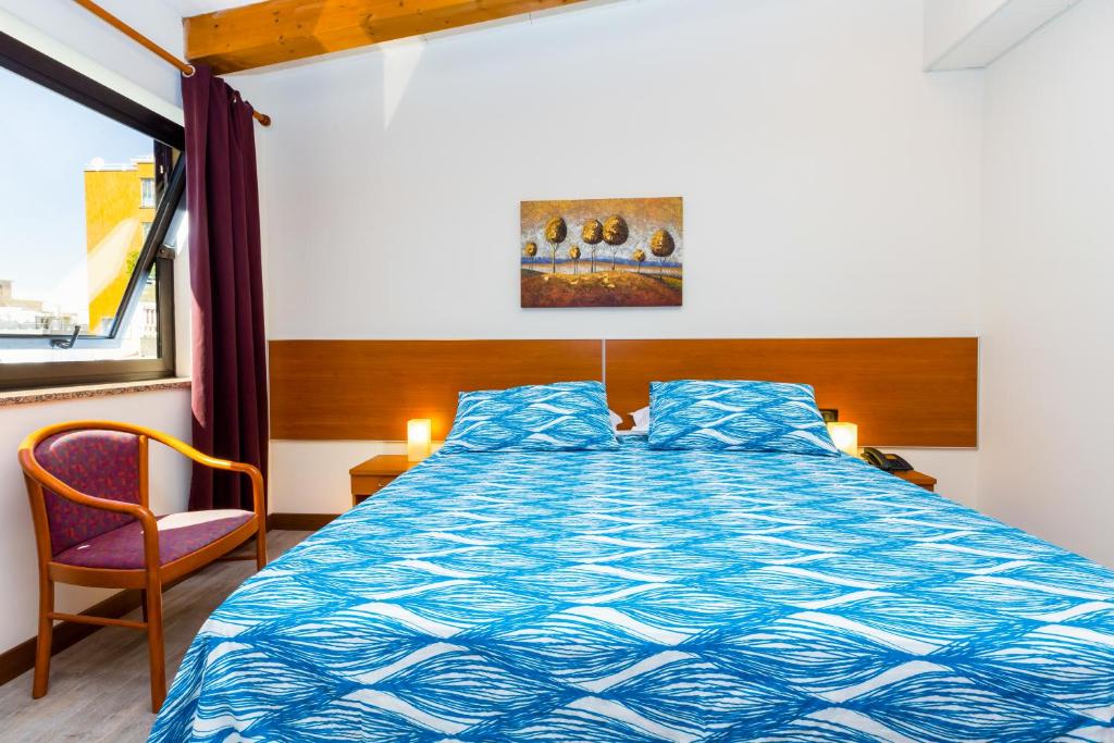 Postel nebo postele na pokoji v ubytování Hotel Adria