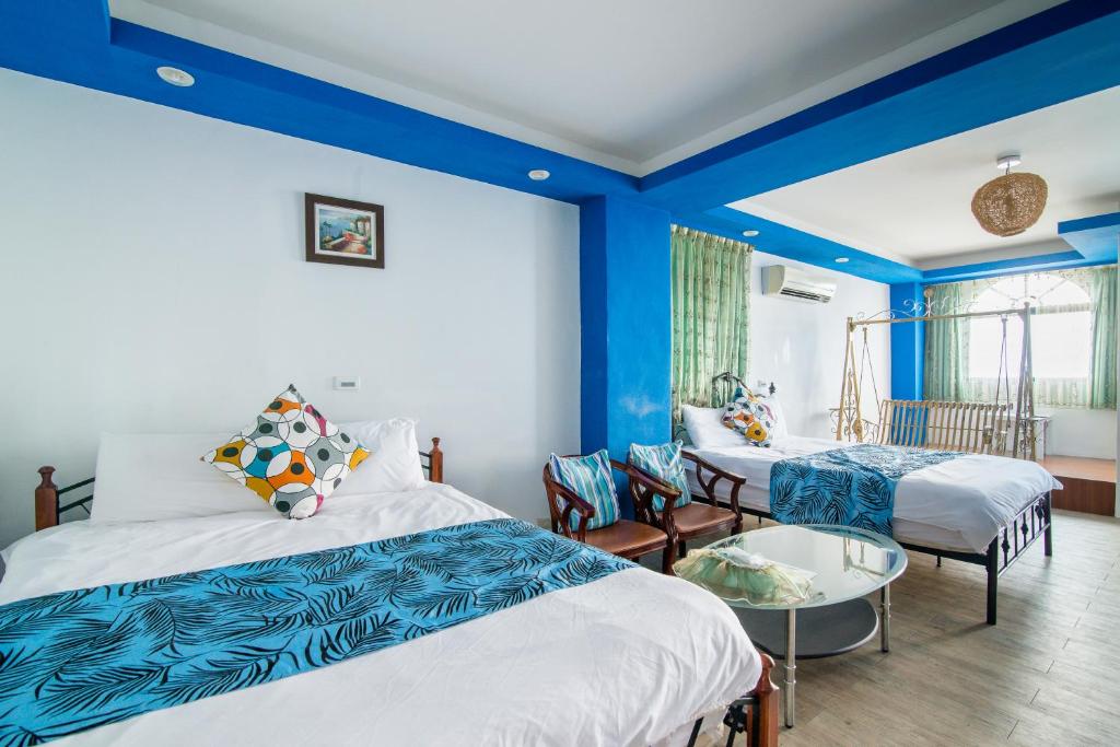 Postel nebo postele na pokoji v ubytování Shengtuolini B&B