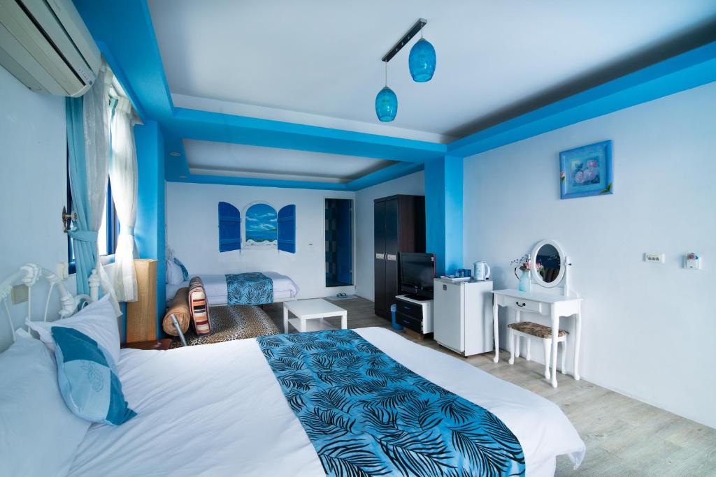 Postel nebo postele na pokoji v ubytování Shengtuolini B&B