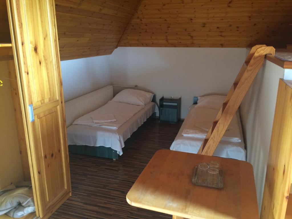 Postel nebo postele na pokoji v ubytování Vénusz Panzió és Vendéglő
