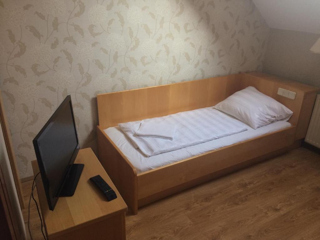 Postel nebo postele na pokoji v ubytování Vénusz Panzió és Vendéglő